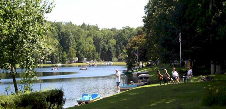 contact a gathering of campers at the lake